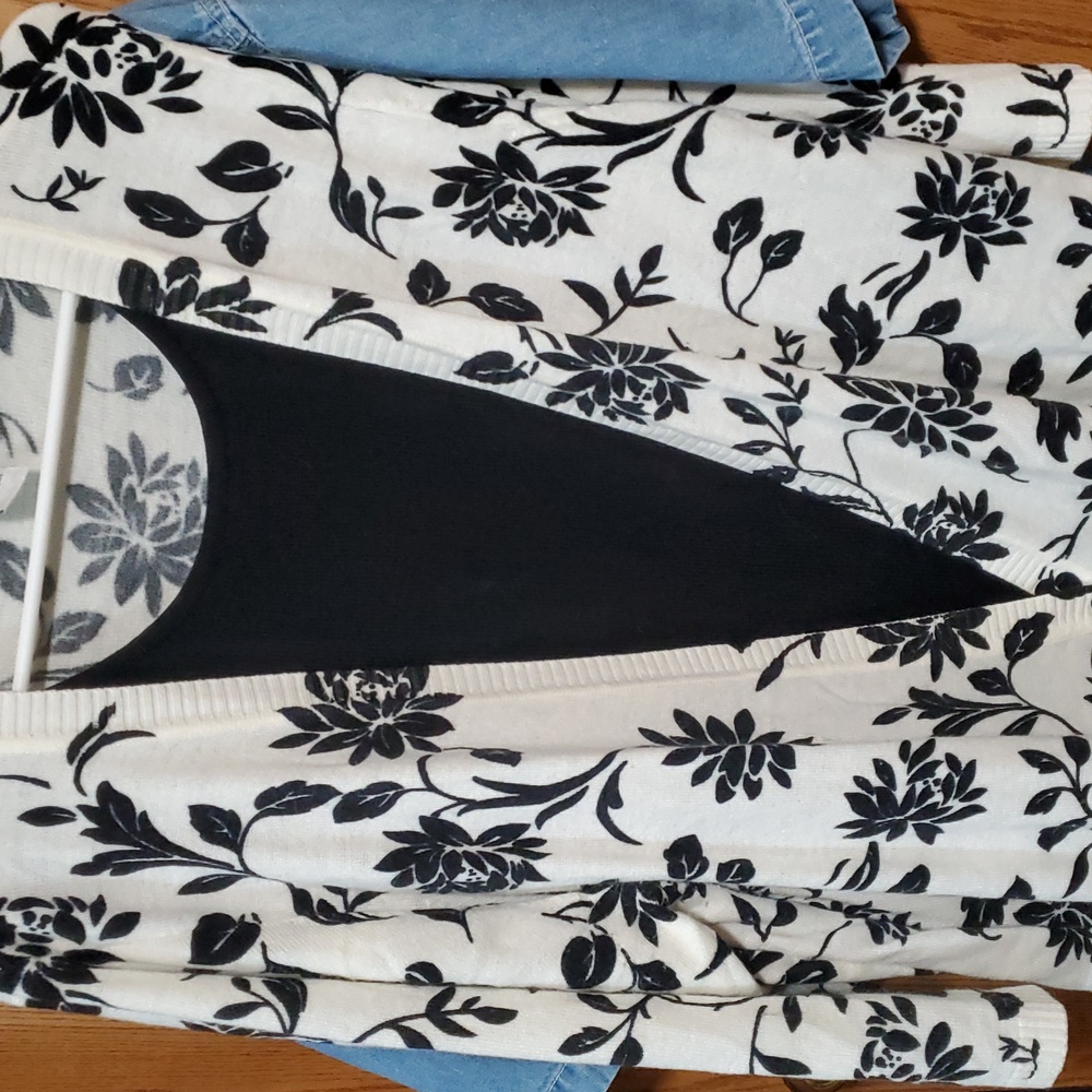 White and black layered cardigan with black sweater tee sewn in. Cathy Daniels